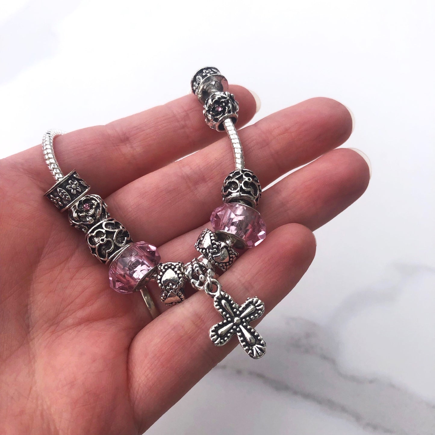 Bracelet - silver charms with cross pink